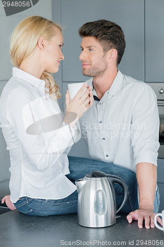 Image of Loving couple drinking coffee together