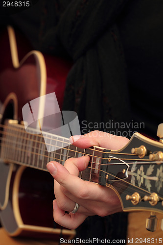 Image of Playing the guitar