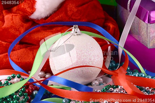 Image of Christmas background with gift box, diamonds, new year balls
