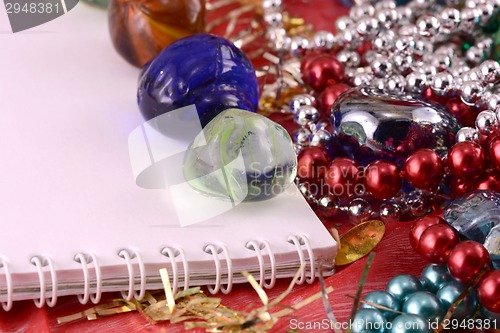 Image of Christmas greeting card with stones, pearls and paper note