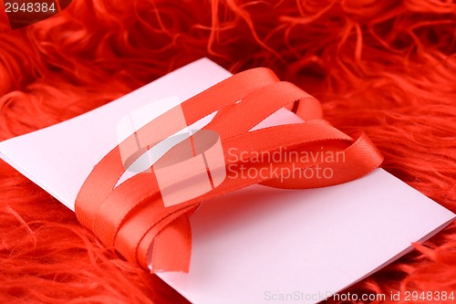 Image of Greeting card with white paper and red bow