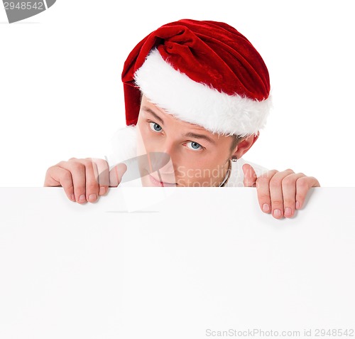 Image of Young man in Santa hat