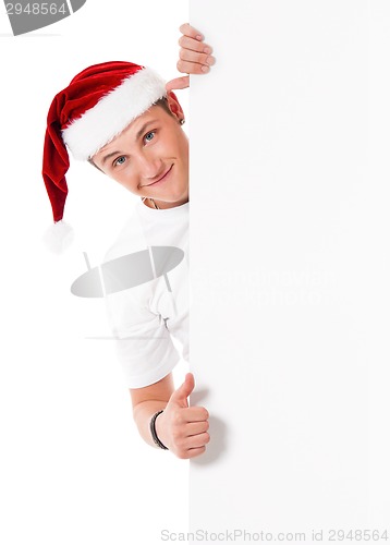 Image of Young man in Santa hat