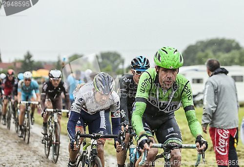 Image of The Peloton on a Cobbled Road- Tour de France 2014