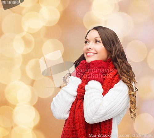 Image of smiling young woman in winter clothes