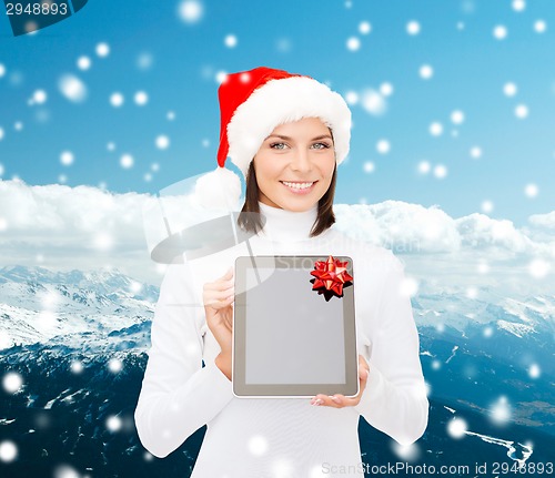 Image of woman in santa helper hat with tablet pc