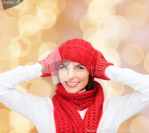 Image of smiling young woman in winter clothes