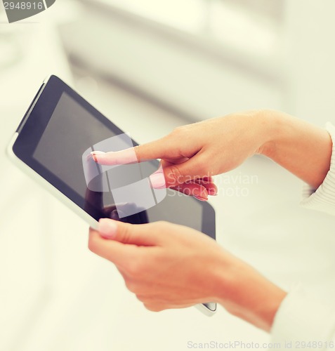 Image of businesswoman with tablet pc in office