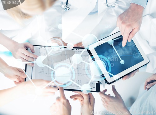 Image of group of doctors with tablet pc and clipboard