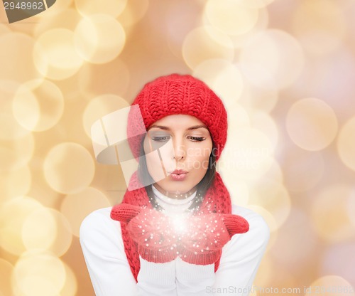 Image of smiling young woman in winter clothes