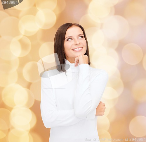 Image of smiling young woman in winter clothes