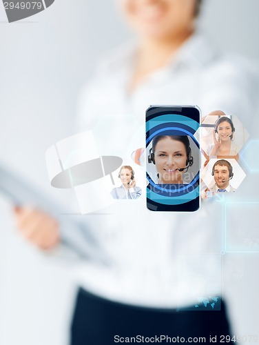 Image of close up of businesswoman showing smartphone