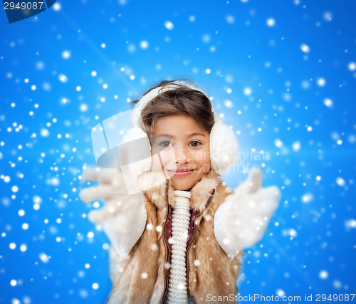 Image of smiling little girl in winter clothes