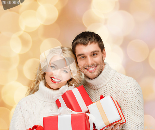 Image of smiling man and woman with presents