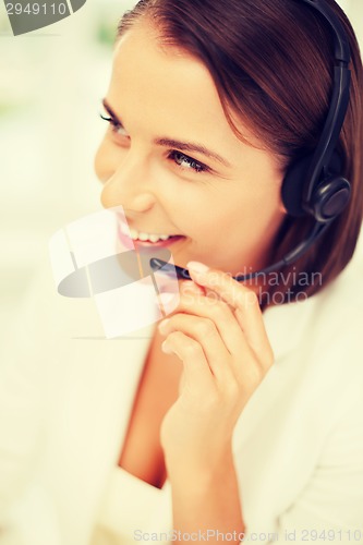 Image of female helpline operator with headphones