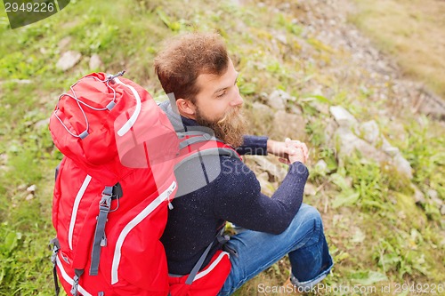 Image of man with backpack hiking