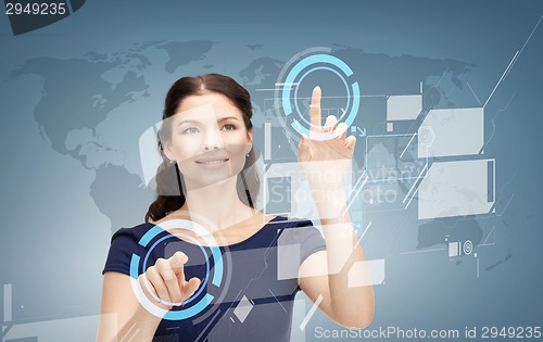 Image of smiling businesswoman working with virtual screen