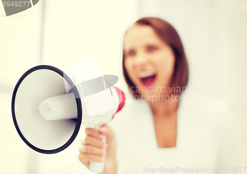 Image of strict businesswoman shouting in megaphone