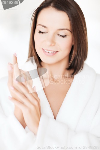 Image of beautiful woman in bathrobe