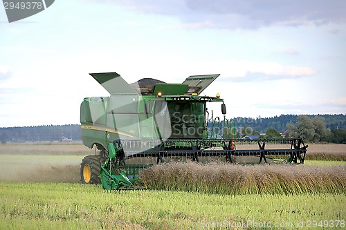 Image of John Deere Combine on Rapeseed Field