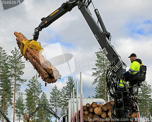 Image of Competitor stacking wood in Finnish Log Loading Championships 20