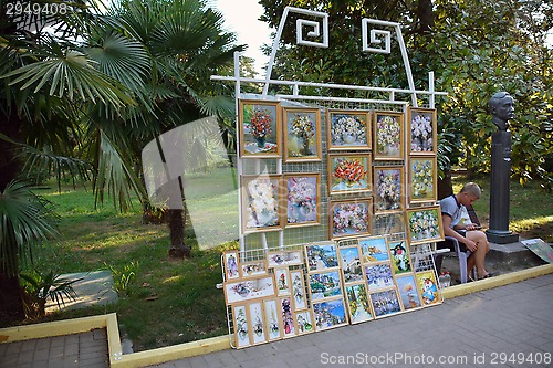 Image of The artist selling pictures in the park