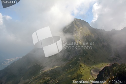 Image of Mountain in the Caucasus with the cloud in the front.