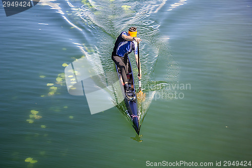 Image of Man rowing in a canoe 