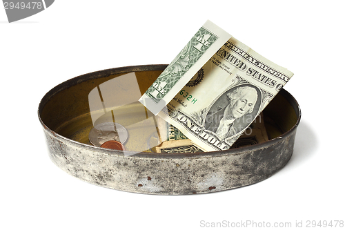 Image of Tin can with money