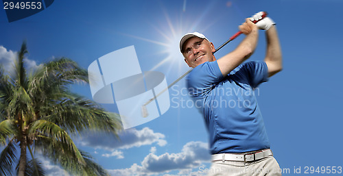 Image of 	golfer shooting a golf ball