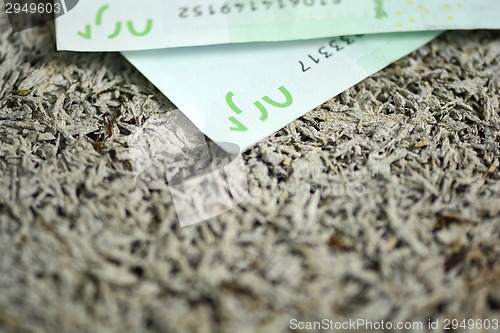 Image of Close-up of  100 Euro banknotes isolated on white background.
