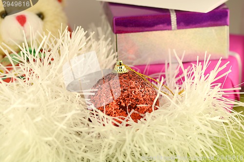 Image of Christmas red gift with red ball, new year card