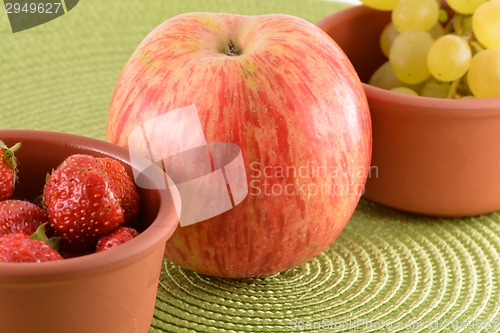 Image of fresh fruits. strawberry, apple, grape