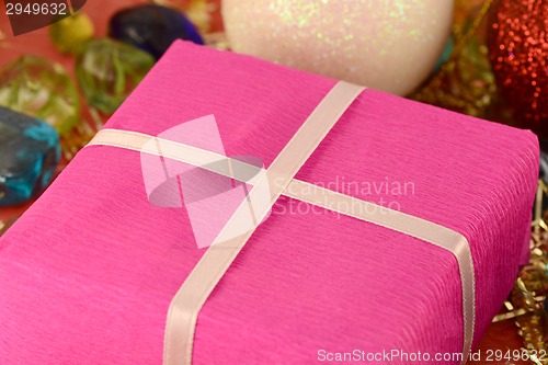 Image of red gift box on christmas background
