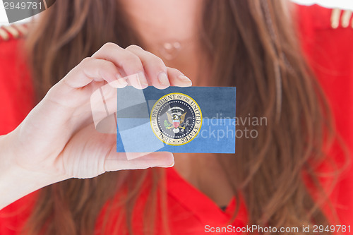 Image of Woman showing a business card