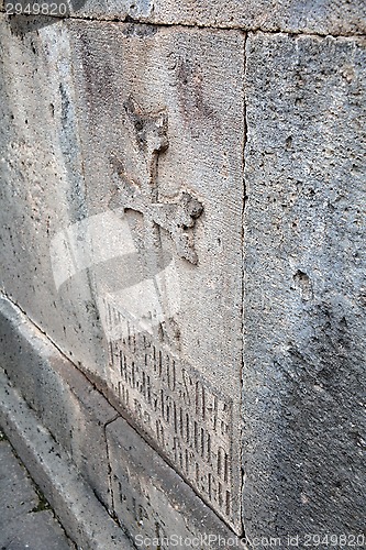 Image of Cross on the wall of Geghard monastery