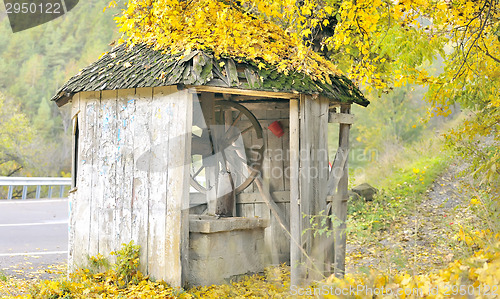Image of old fountain on autumn time