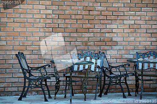 Image of Two metal decorated cafe tables