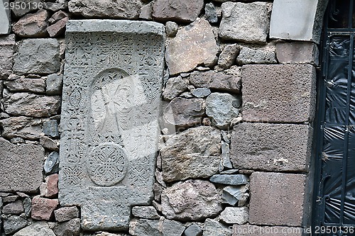 Image of The carved hachkar embedded to the wall of Geghard monastery, Ar