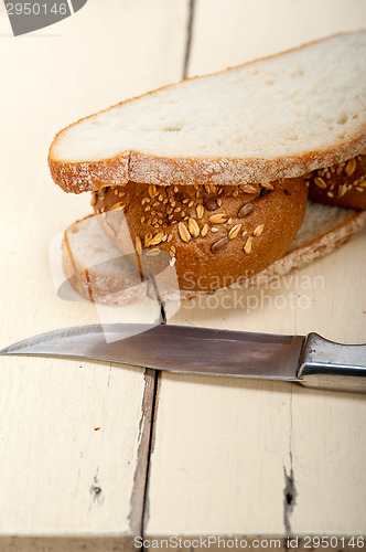 Image of organic bread over rustic table