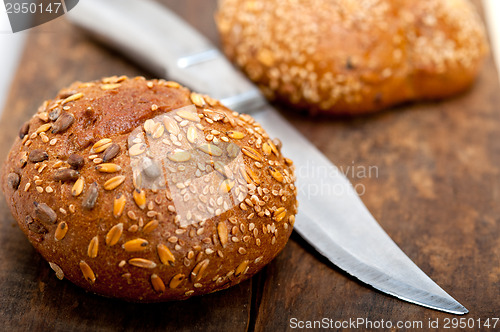 Image of organic bread over rustic table