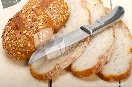 Image of organic bread over rustic table