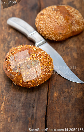 Image of organic bread over rustic table