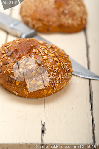 Image of organic bread over rustic table