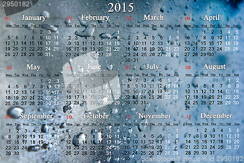 Image of calendar for 2015 year on the surface with drops