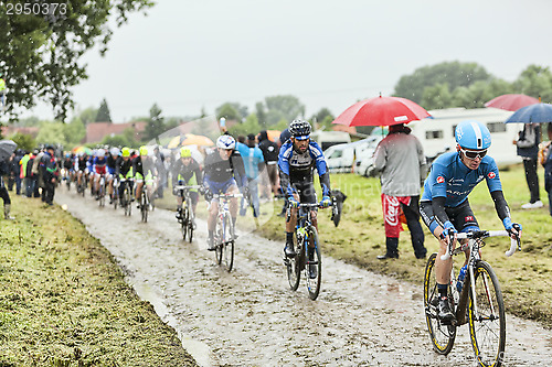 Image of The Cyclist Tom Jelte Slagter on a Cobbled Road - Tour de France