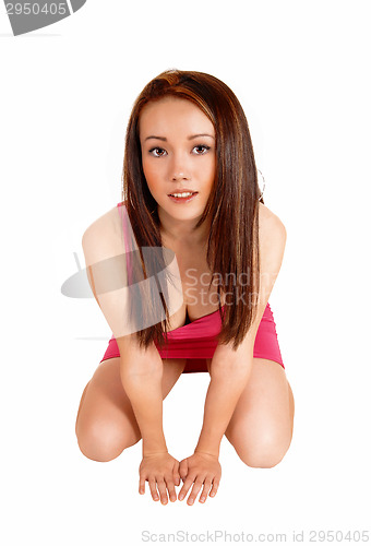 Image of Crouching woman on floor.