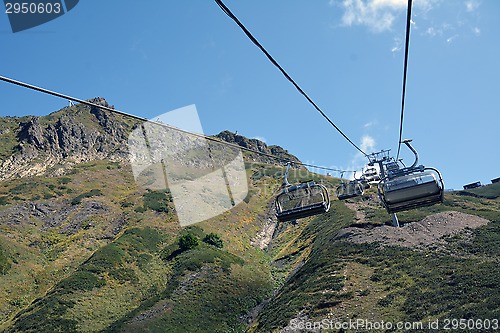Image of The row of the moving chair lifts