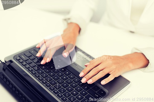 Image of businesswoman using her laptop computer