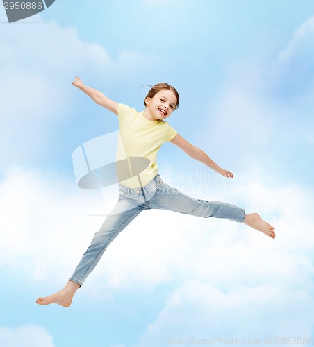 Image of smiling little girl jumping